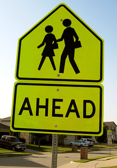 Going back to college - school ahead street sign