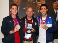 Diploma Mill Recipient Drew Johansen, Center, with Two Olympic Athletes