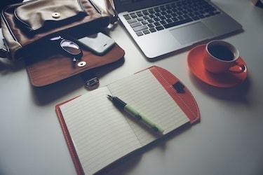 Online project management degree student's desk