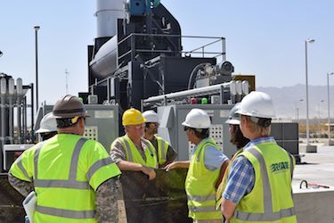 Online engineering management degree grads working on a job site