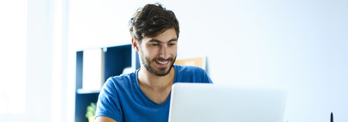 Man working on computer in one of the best paying jobs in technology