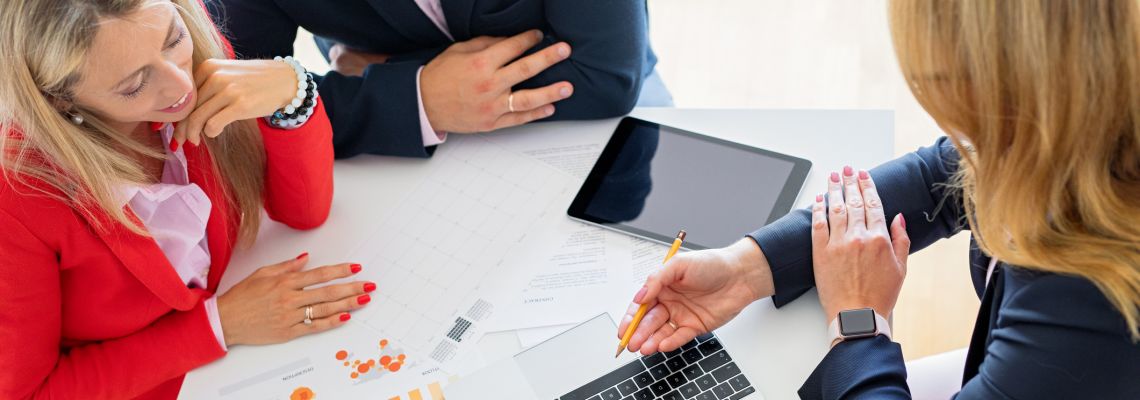 Man and woman getting help from professional financial consultant, view from above