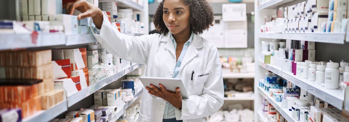 Online pharmacy tech programs provide career skills that this worker is using