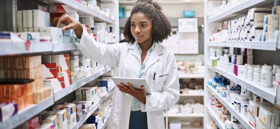 Online pharmacy tech programs provide career skills that this worker is using
