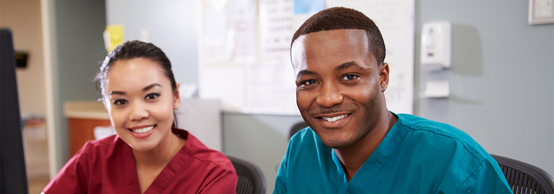 iStock-465588451.v2 Female and Male nurse smiling