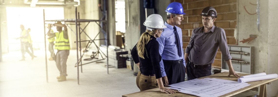 Careers in construction management might involve talking to architects at construction site