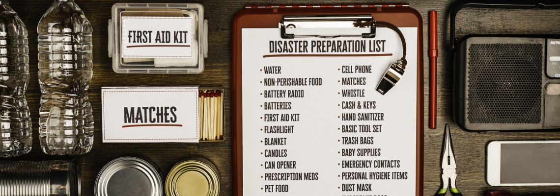 Disaster preparation kit flat lay. Items needed for disaster preparedness Emergency Management Director's tool kit.