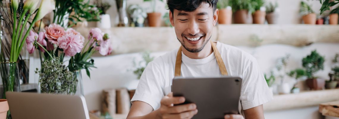 Asian man uses bachelors in business to start small business.