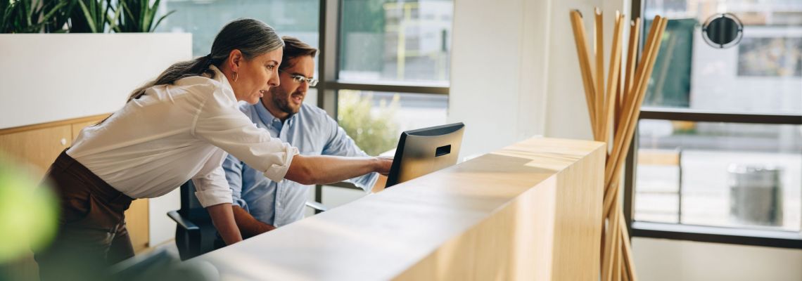 Operations management team working at a computer.