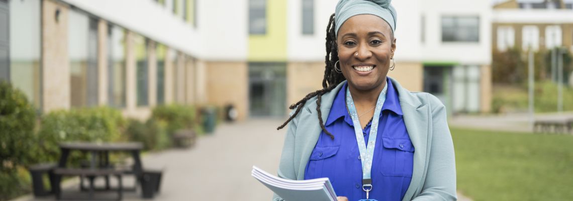 Portrait of confident Black female educator who has learned how to become a principal and is now working