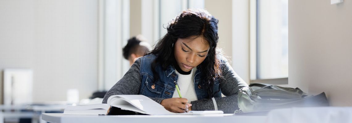 Young woman studies in a hybrid learning environment