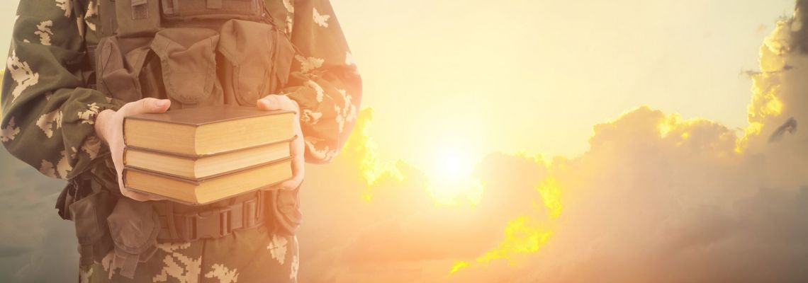 Cadet of gi bill online classes with books on sunrise background.