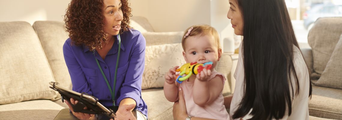 official chatting to young mother, best public health careers best public health careers
