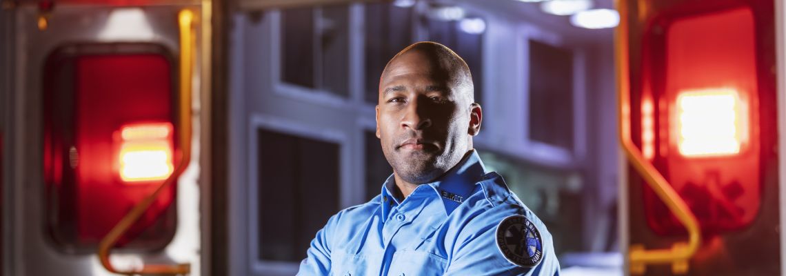 Emergency Medical Services Degree Online, Paramedic in front of ambulance Emergency Medical Services Degree Online