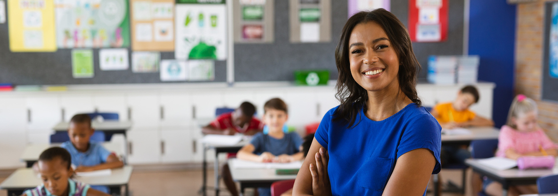 Learn how to become a teacher like this female educator in her classroom