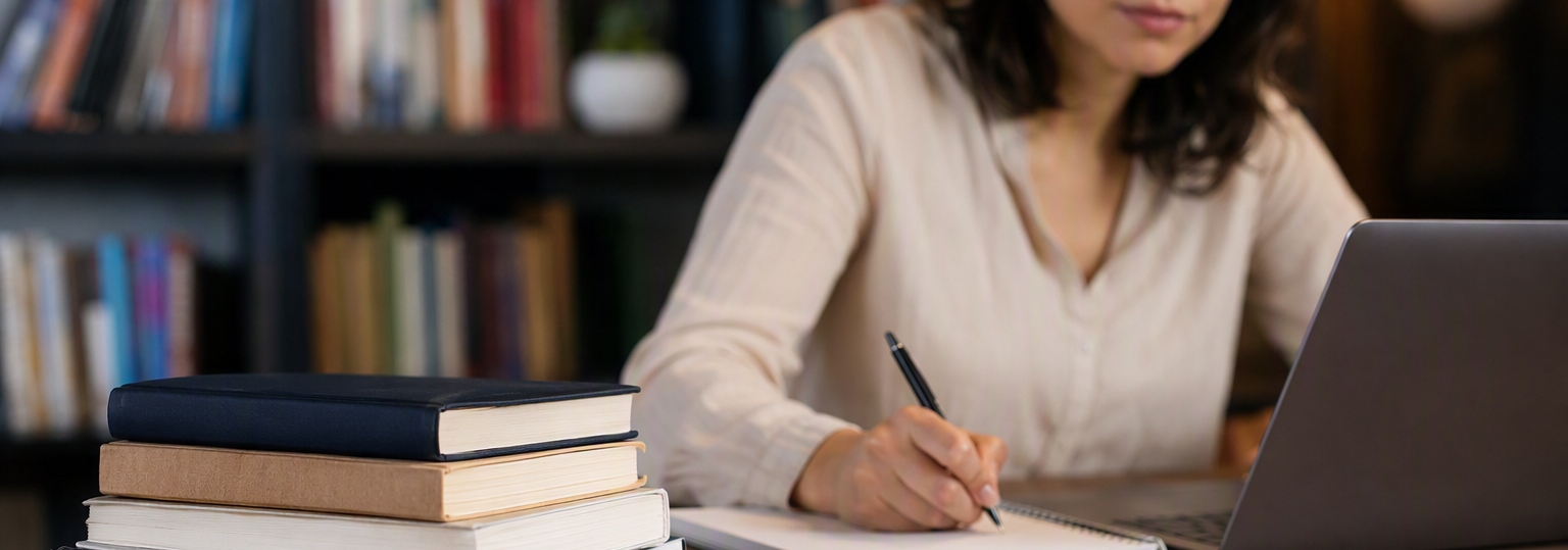 Group of adults engaged in a collaborative study session for an online master's in English