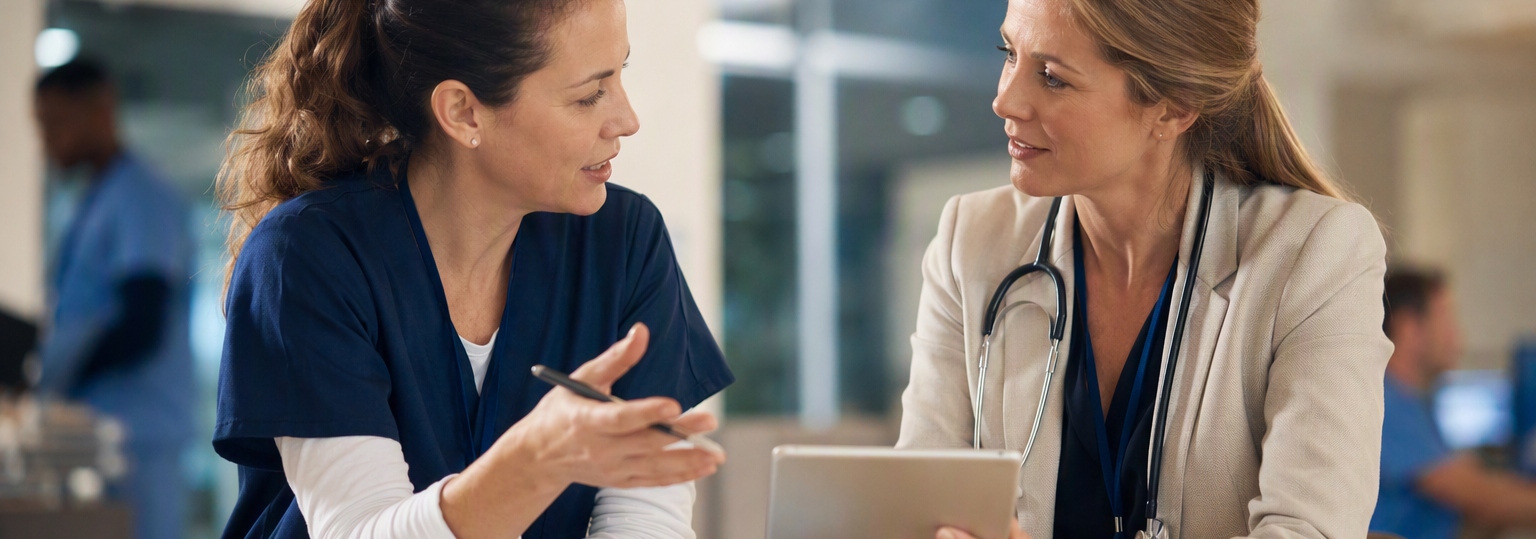 Working adults discussing nursing administration opportunities in a professional healthcare setting