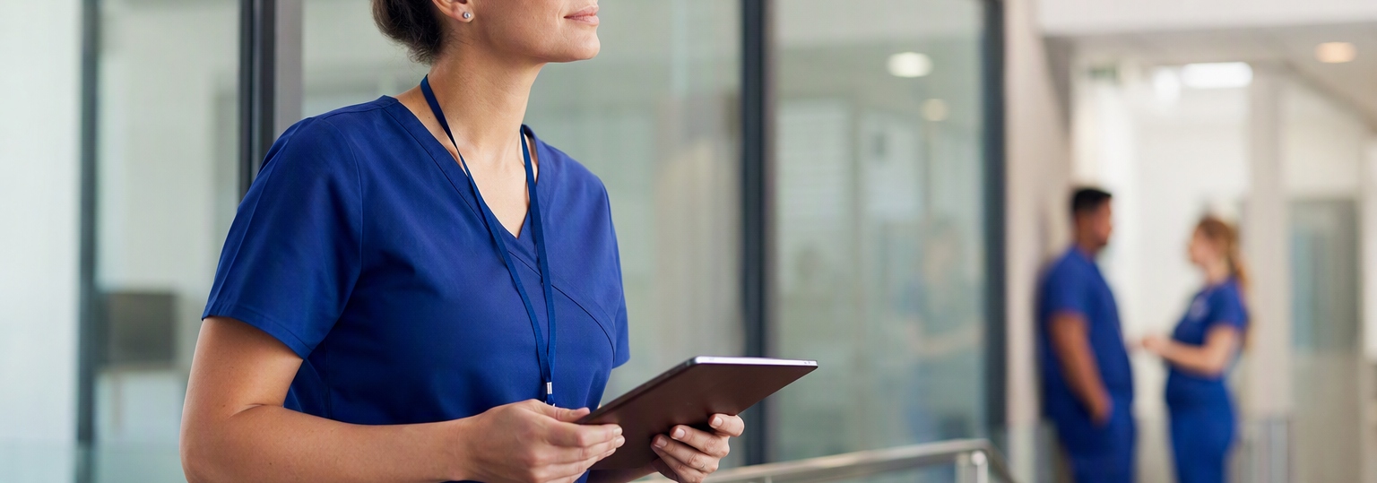 Nurse in professional attire contemplating leadership options in a modern learning environment