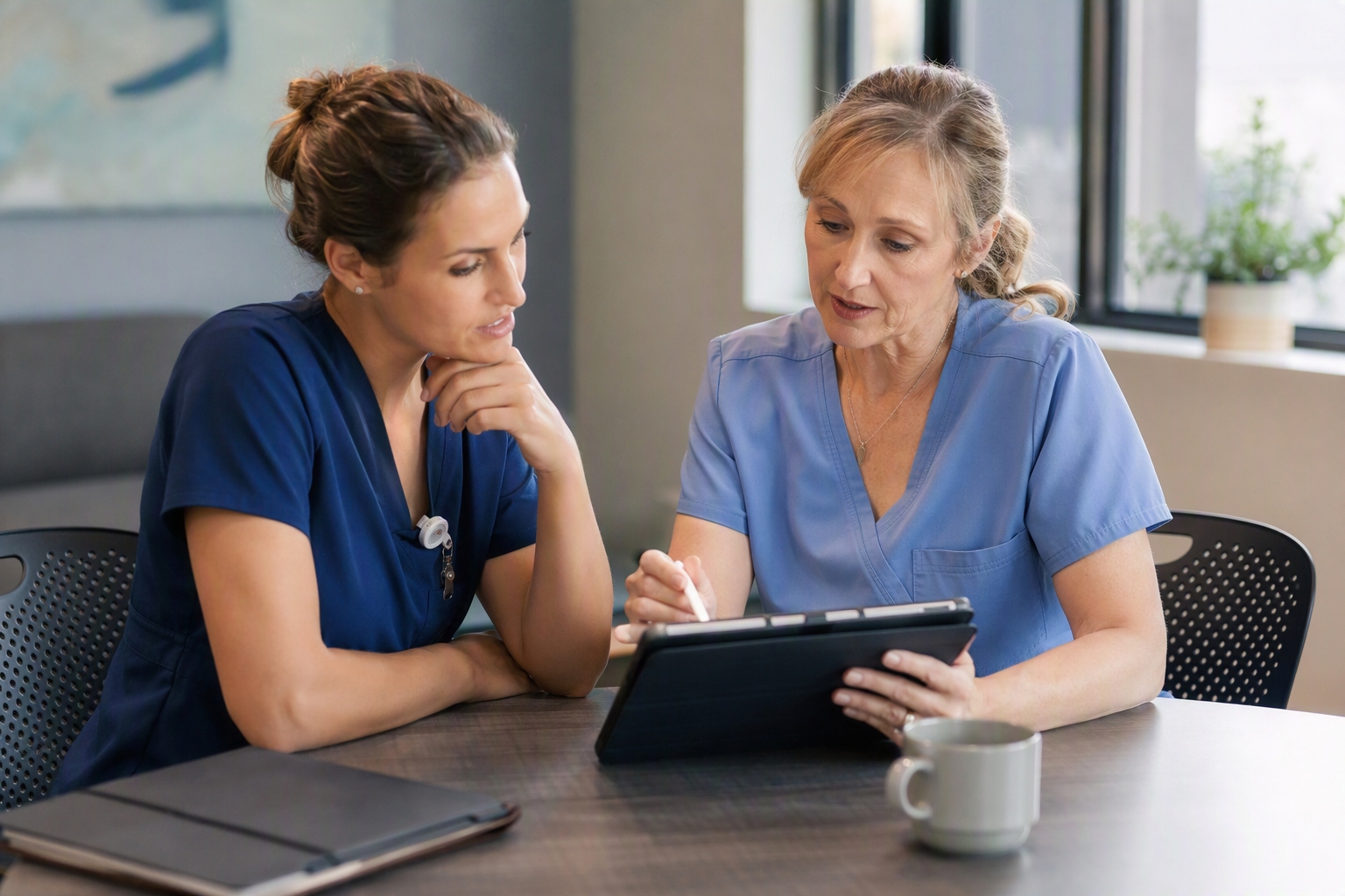 Nurse and faculty preceptor discussing a practicum plan for nurse educator master's program