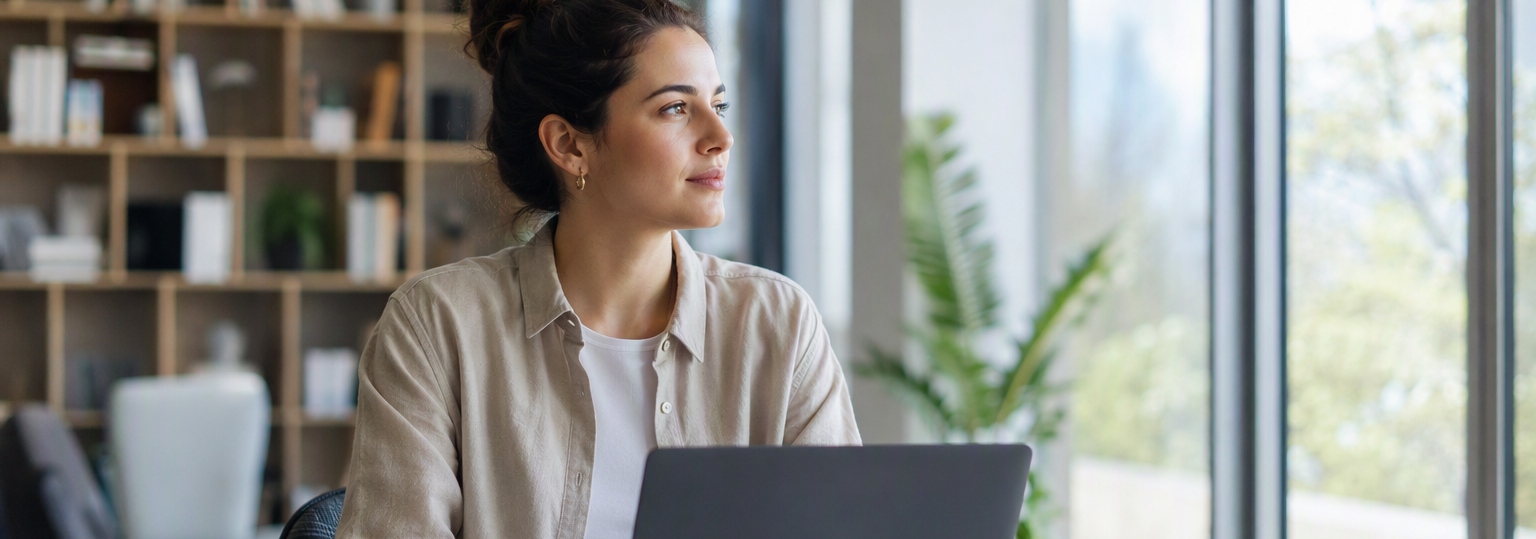 Adult learner considering an online English bachelor's in technical writing, studying in a bright office